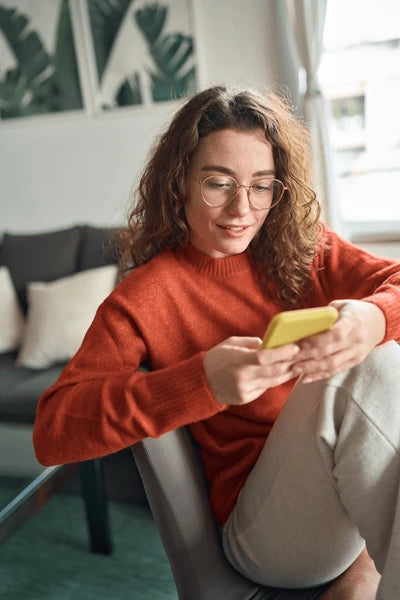 files/young-pretty-woman-holding-smartphone-600nw-2249452169.webp